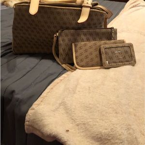 Dooney Bourke tan purse with handles used ounce